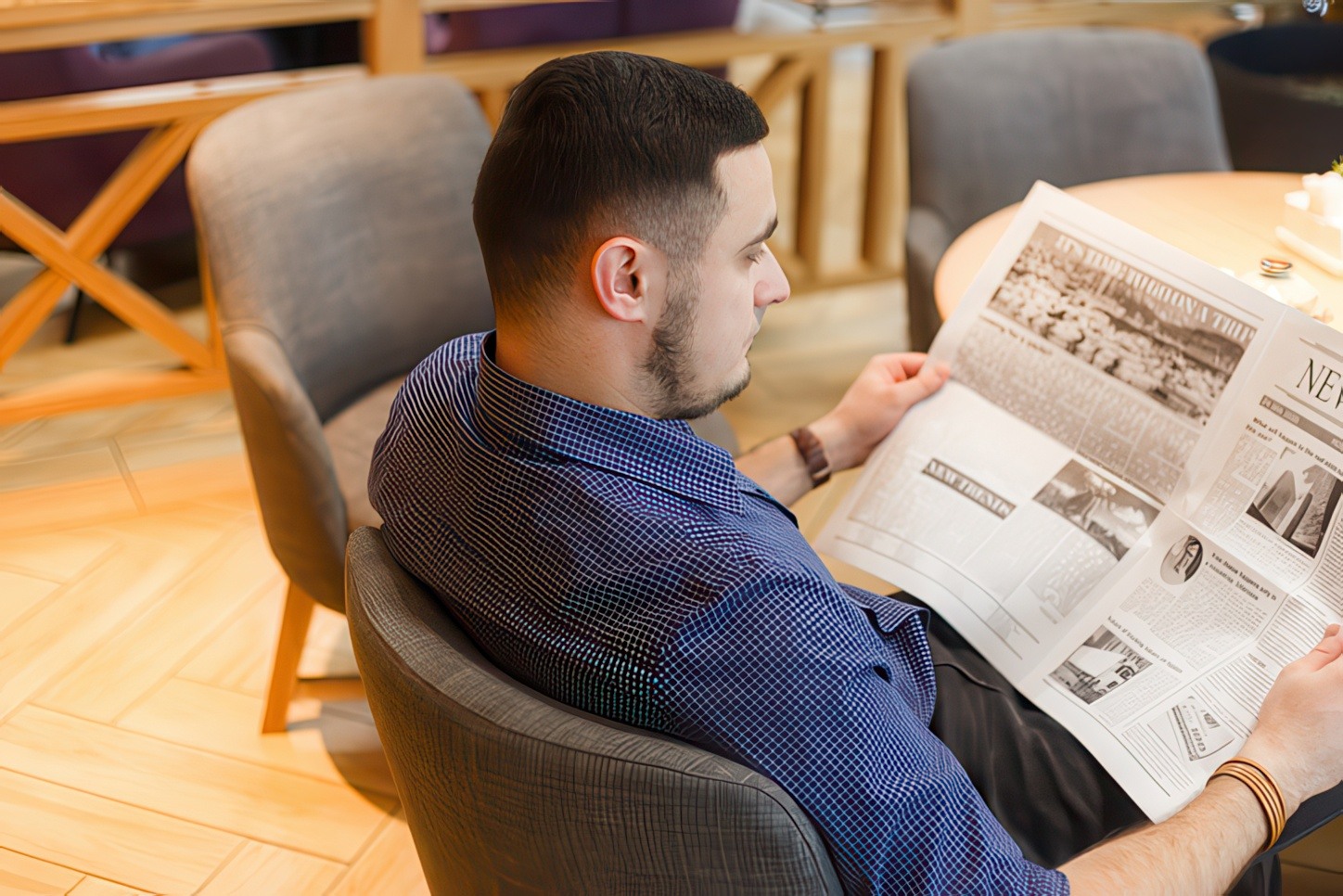 Man reading a newsletter